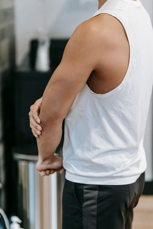 Man holding his elbow for joint discomfort
